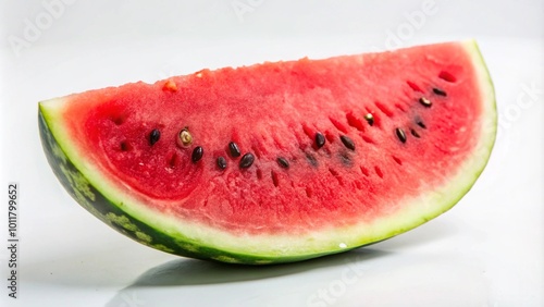 A slice of ripe watermelon with black seeds on a white background.