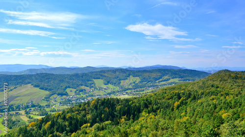 Fototapeta Naklejka Na Ścianę i Meble -  Panorama of mountains and hills  in Szpilowka Range, Carpathian Foothills,  Poland. View from top of wooden tower for tourists  above Iwkowa village near Brzesko town.