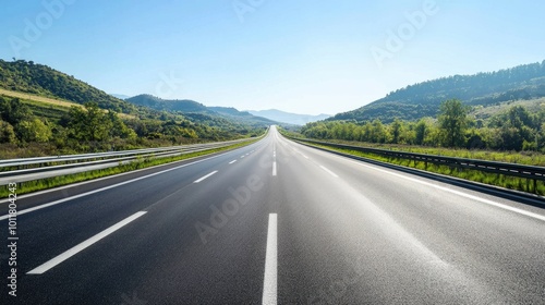 Open Road Through Lush Green Landscape