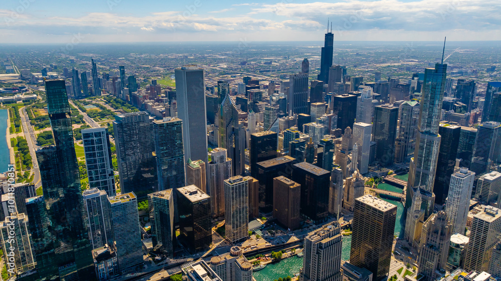 Jaw-dropping panorama of modern vibrant Chicago, Illinois, United States. Huge skyscrapers standing out from the cityscape. Aerial view. Jaw-dropping panorama of modern vibrant Chicago, Illinois, United States. Huge skyscrapers standing out from the cityscape. Aerial view.