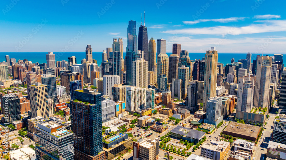 Fototapeta premium Splendid scenery of modern Chicago downtown on beautiful clear sunny day. Drone footage above the cityscape.