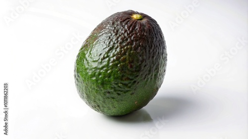 A single, green avocado with a slightly bruised skin, isolated against a white background.