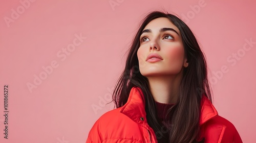 Portrait of a Woman in Red with Long Dark Hair Looking Upward photo