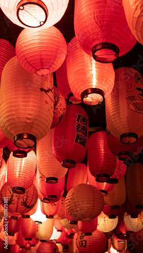 Red and white paper lanterns with Japanese letters and signs