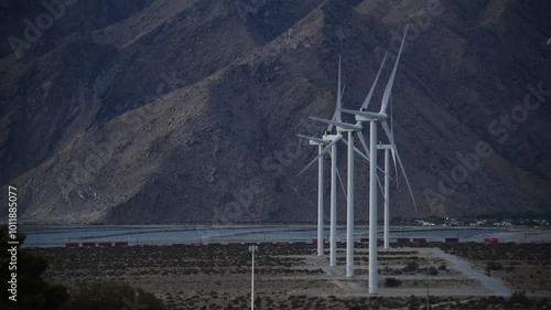 Wind Turbines renewable energy below mountains