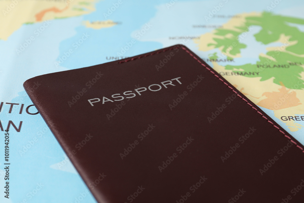 One passport on world map, closeup view One passport on world map, closeup view