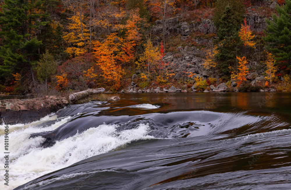 French River Rough Rapid Water Whirlpools of the Recollet Falls. Gray Stormy Autumn Day at French River in Killarney, Ontario, Canada French River Rough Rapid Water Whirlpools of the Recollet Falls. Gray Stormy Autumn Day at French River in Killarney, Ontario, Canada