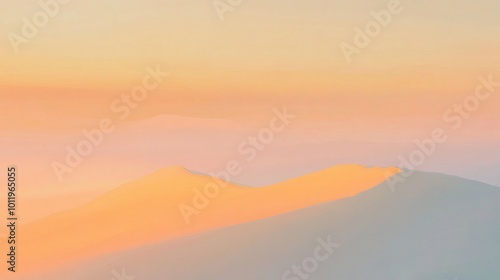 Soft gradients of apricot paint the sky highlighting distant mountains as day fades