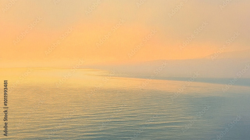 Obraz premium Gentle waves reflect the soft hues of a pastel sky just before nightfall