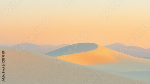 Gentle rolling dunes stretch under a warm golden light evoking calmness at dusk