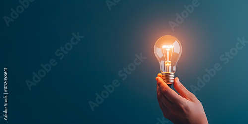 Hand Holding a Glowing Light Bulb for Innovative Idea | Symbol of Creativity, Inspiration, and Bright New Concepts