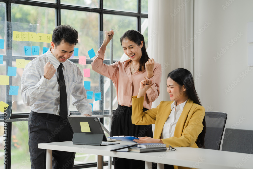Office Celebration: A diverse team of business professionals celebrates a success, with smiles, raised fists, and a shared sense of accomplishment. Office Celebration: A diverse team of business professionals celebrates a success, with smiles, raised fists, and a shared sense of accomplishment.