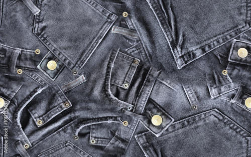 Seamless pattern of real denim pants. Black jeans patchwork texture with gold buttons and rivets. Template with web banner, poster, card, greeting for social networks and media. Abstract background 8K