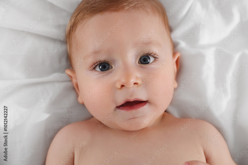 Cute little baby on bed, top view Cute little baby on bed, top view