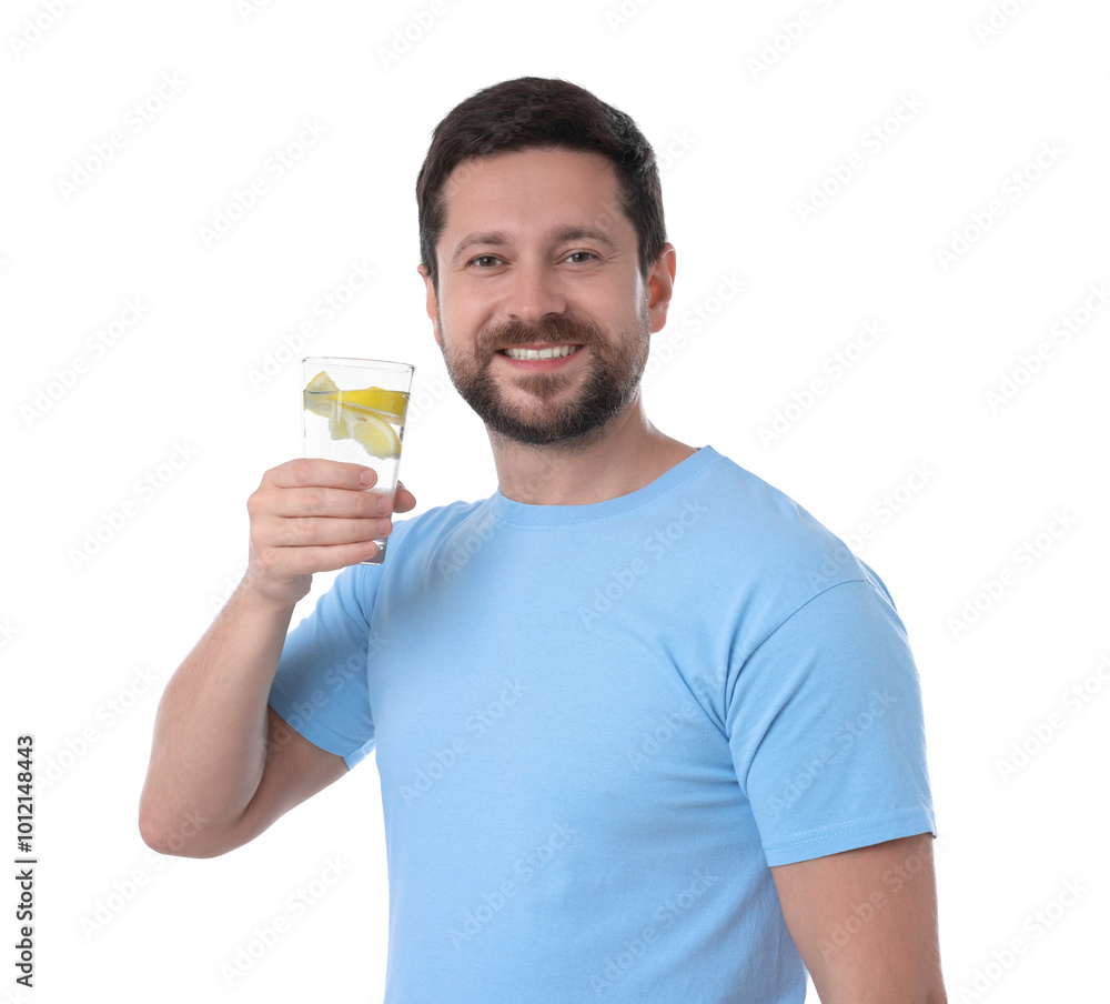 Happy man holding glass of water with lemon on white background