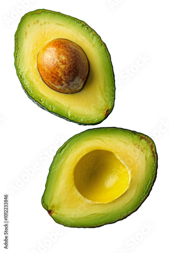 Ripe avocados cut open to reveal creamy interior and seed on a white background
