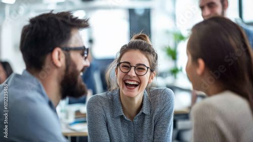 A vibrant team debating a decision in an open office space, laughing and smiling as they exchange ideas. The blurred background of office desks and windows adds to the modern and optimistic ambiance.