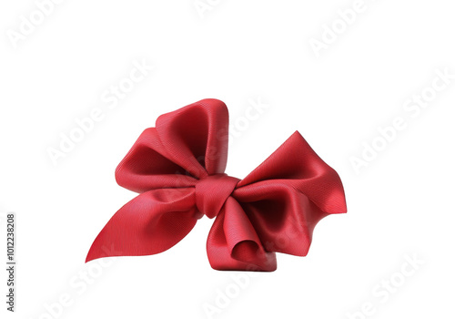 Elegant red ribbon twisted into a bow, resting on a simple white background