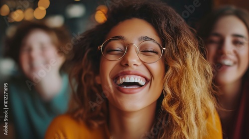 A close-up photo of a diverse group of friends enjoying time together, smiling and laughing.