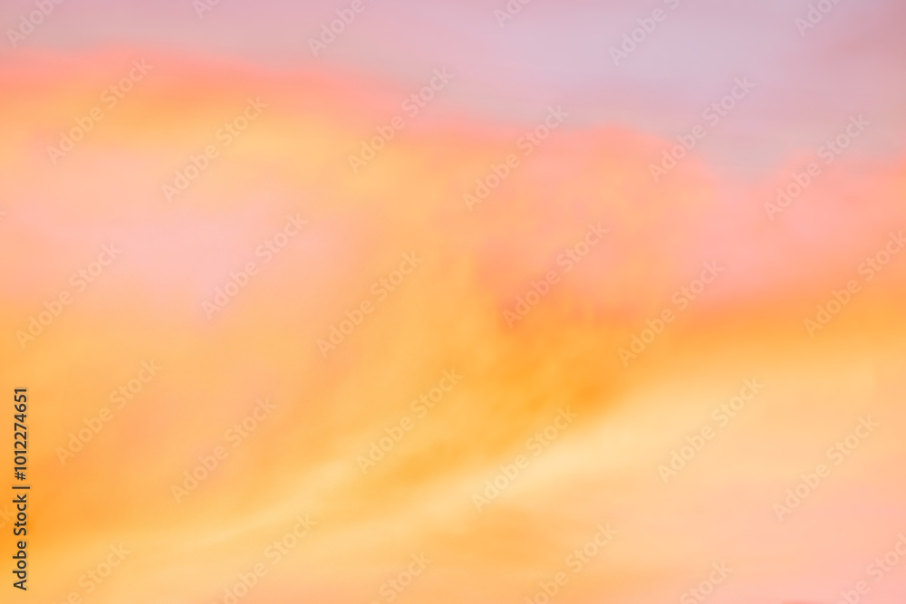 Fototapeta premium A beautiful sky tinted by the sun leaving vibrant shades of gold, pink, blue and multicolored. Clouds in the twilight evening and morning sky. Cloudy sky background in the evening, and during the day.