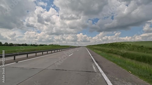Wallpaper Mural Road view on a autumn day. Highways and sun, roadside and white road line markings. Torontodigital.ca