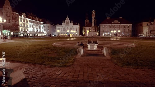 the center of the city of Timisoara, historical buildings illuminated by magical streetlights, Piata Unirii, 4k