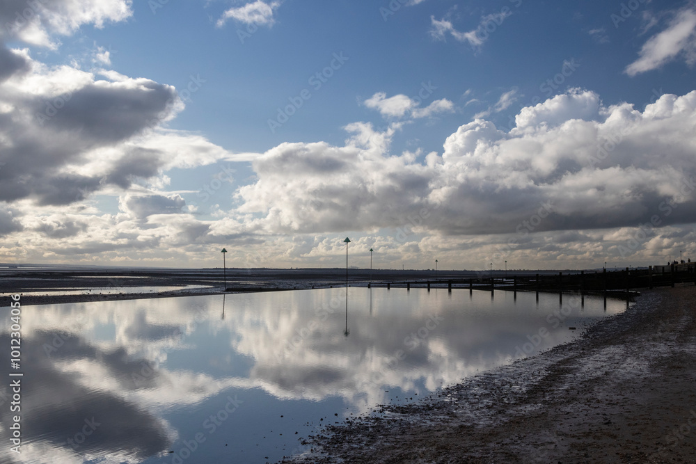 Reflections on Westcliff beach, near Southend-on-Sea, Essex, England, United Kingdom Reflections on Westcliff beach, near Southend-on-Sea, Essex, England, United Kingdom