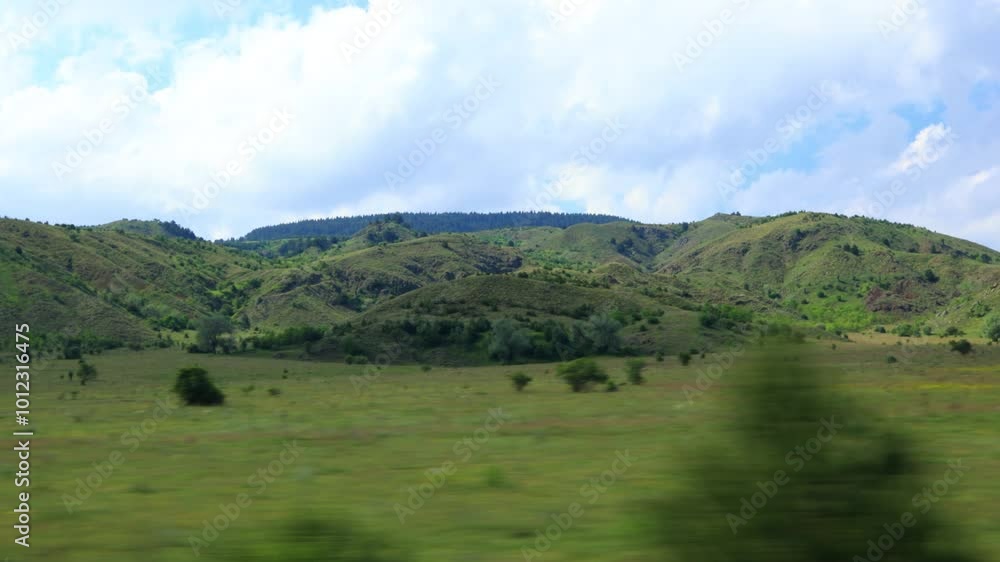 roadside view, road and landscape, palm trees and mountains, view from the car window roadside view, road and landscape, palm trees and mountains, view from the car window