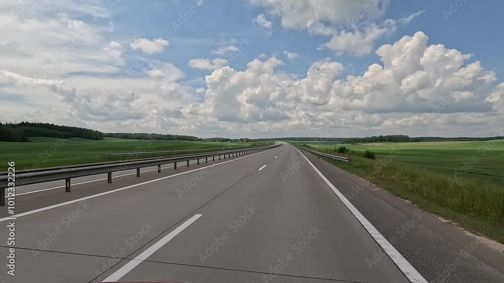 Road view on a summer day. Highways and cars, roadside and white road line markings. Road view on a summer day. Highways and cars, roadside and white road line markings.