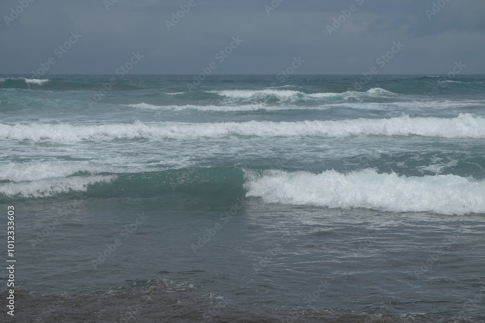 Abstract shapes, patterns and textures of sea waves. Big waves heading towards the beach.For graphic design or banner background Abstract shapes, patterns and textures of sea waves. Big waves heading towards the beach.For graphic design or banner background
