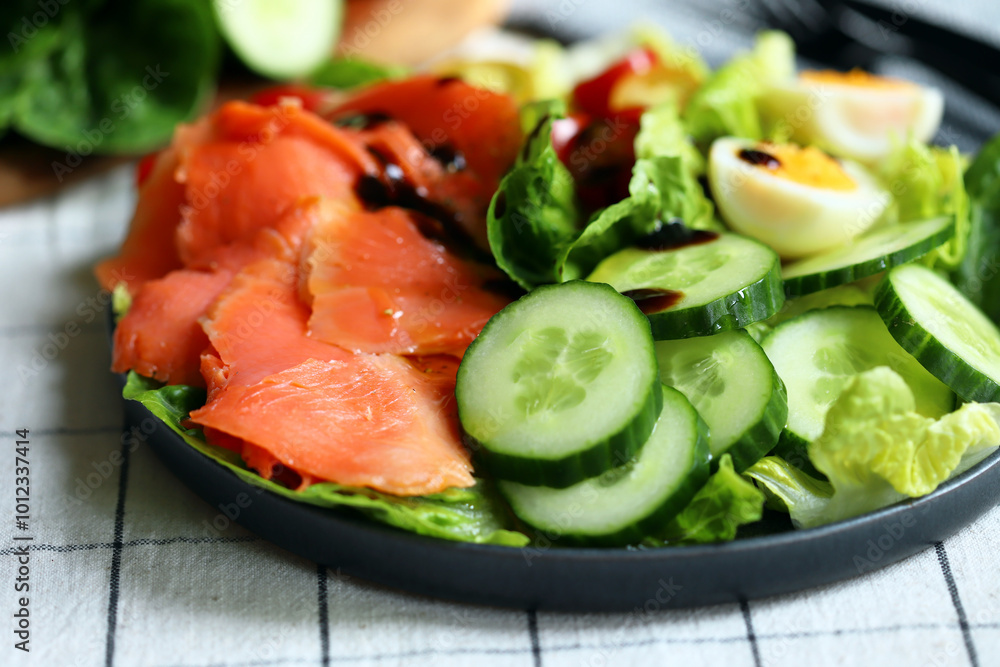 Fresh salad with cucumber, cherry tomatoes and salted salmon Fresh salad with cucumber, cherry tomatoes and salted salmon