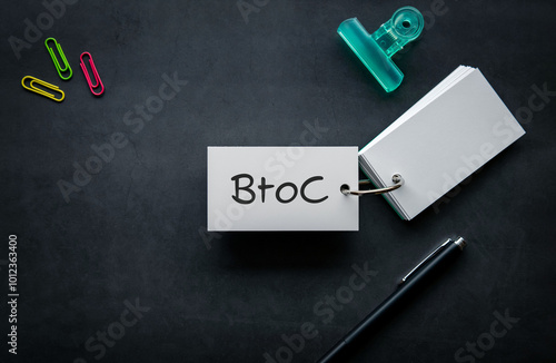 There is notebook with the word BtoC. It is as an eye-catching image. photo