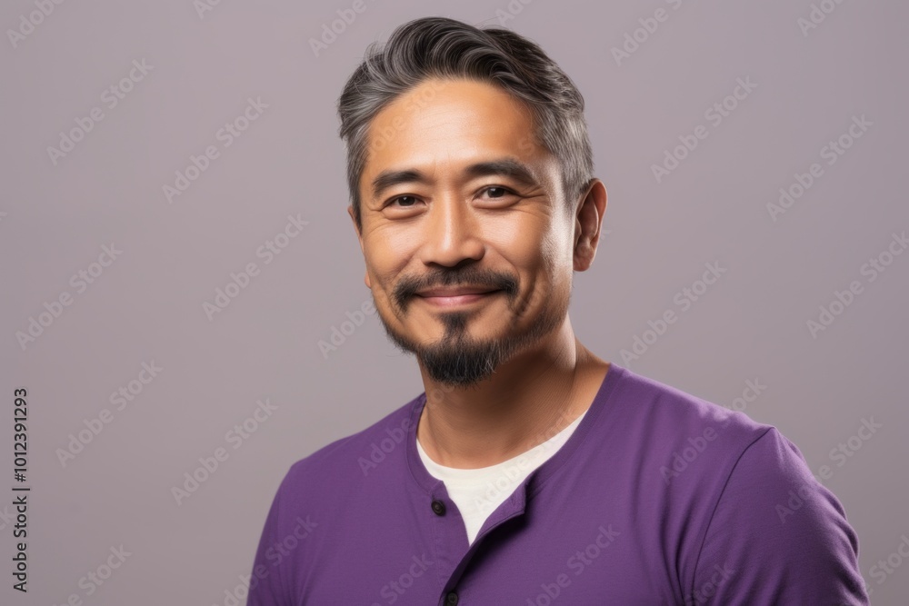 Portrait of handsome asian man in casual clothes on grey background Portrait of handsome asian man in casual clothes on grey background