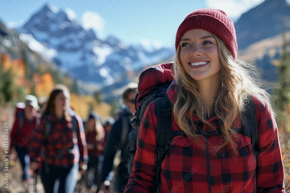 Group of Happy Hikers in the Mountains Led by a Woman in a Red Plaid Jacket Group of Happy Hikers in the Mountains Led by a Woman in a Red Plaid Jacket