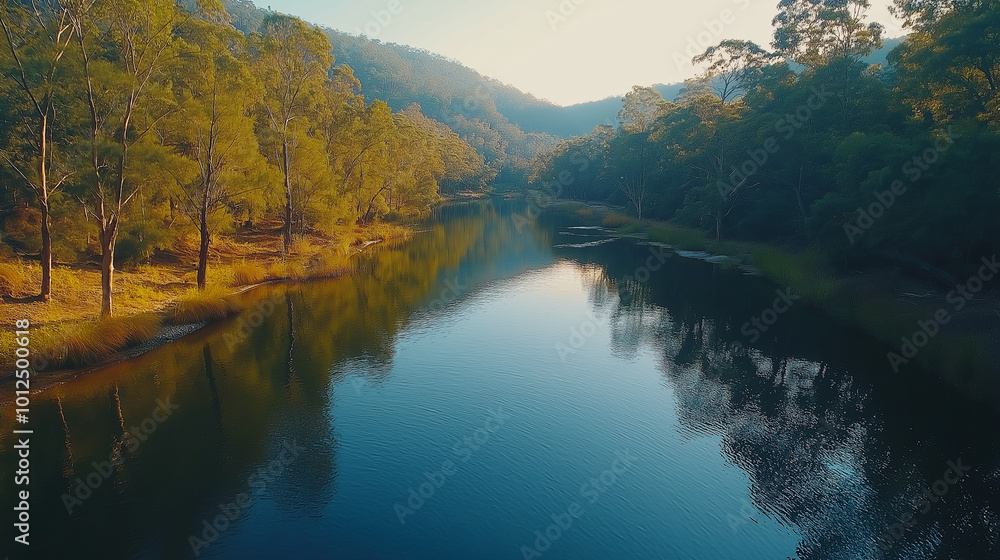 A tranquil nature shot of a calm river meandering through a valley, with crystal-clear water reflecting the surrounding forest A tranquil nature shot of a calm river meandering through a valley, with crystal-clear water reflecting the surrounding forest