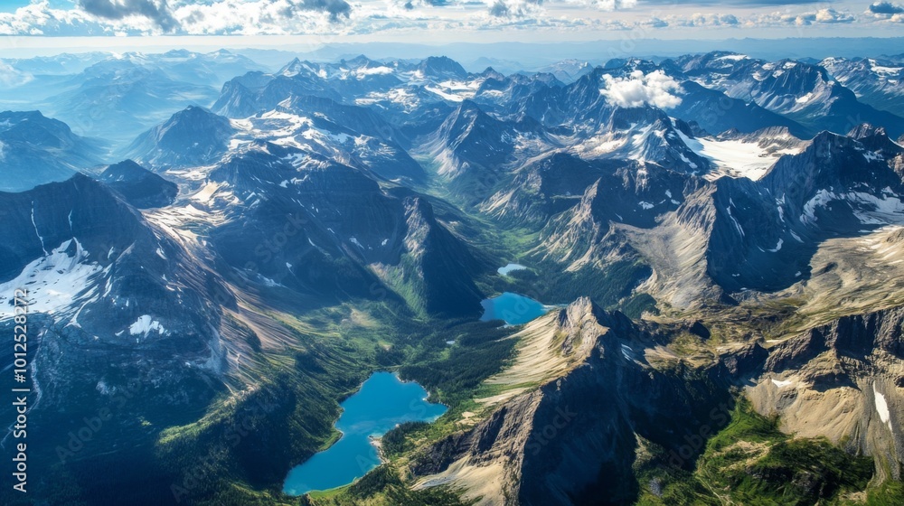 Fototapeta premium Aerial View of Majestic Mountains and Turquoise Lakes in a Remote Wilderness