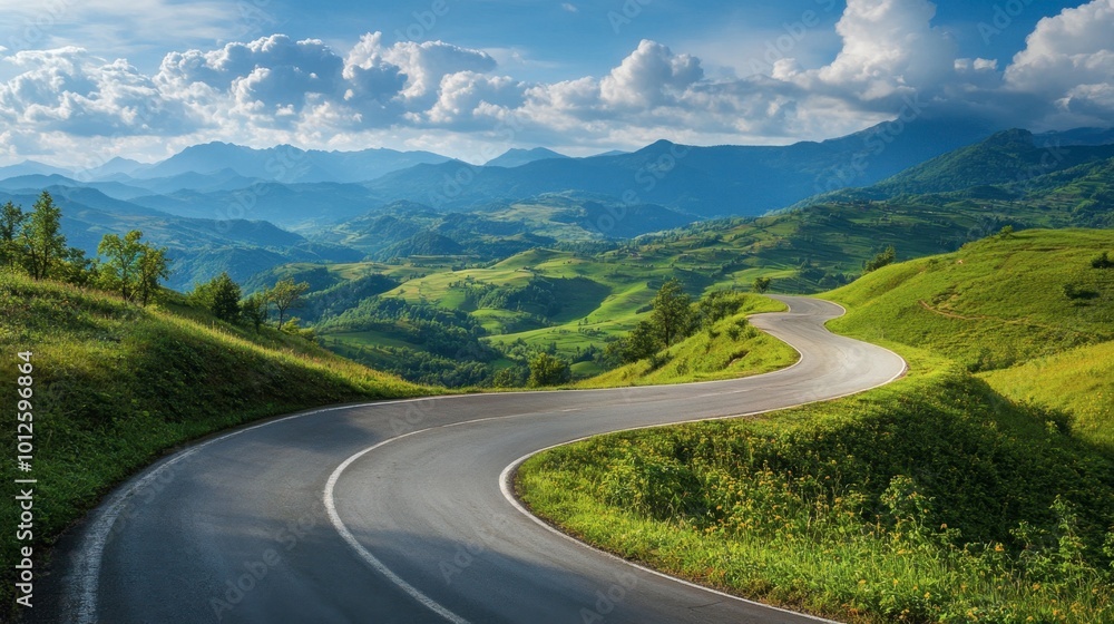 A winding asphalt road through green mountain valleys, with a clear blue sky and soft, fluffy clouds on a sunny day. A winding asphalt road through green mountain valleys, with a clear blue sky and soft, fluffy clouds on a sunny day.