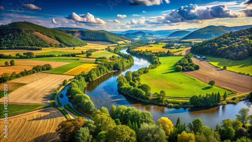 picturesque river winds its way through lush, fertile valley, surrounded by rolling hills and vibrant fields. landscape showcases beauty of nature, with serene atmosphere