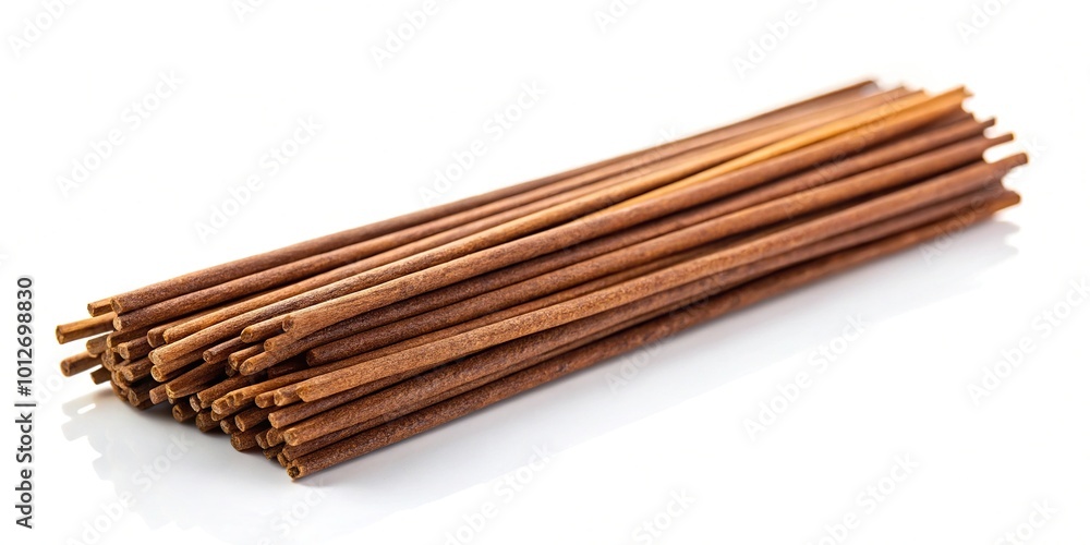 Forced perspective of brown agarbatti or incense sticks isolated on white background Forced perspective of brown agarbatti or incense sticks isolated on white background