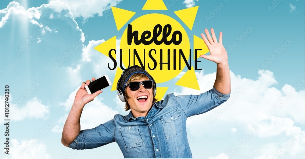 Hello sunshine text over sun icon and caucasian man listening to music against sky with copy space Hello sunshine text over sun icon and caucasian man listening to music against sky with copy space