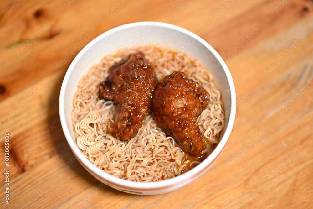 Instant noodles cooked with two pieces of fried chicken Instant noodles cooked with two pieces of fried chicken