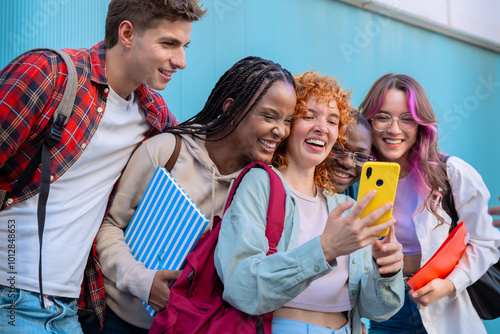 Five students having fun with mobile phones creating content on social media.
