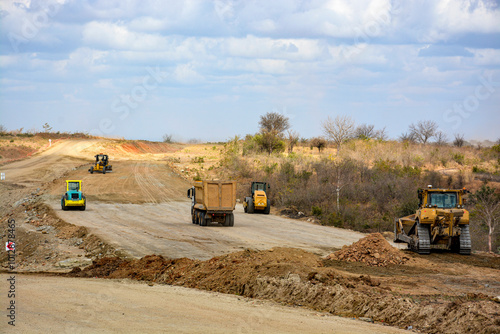 grader and roller machine in the road construction photo