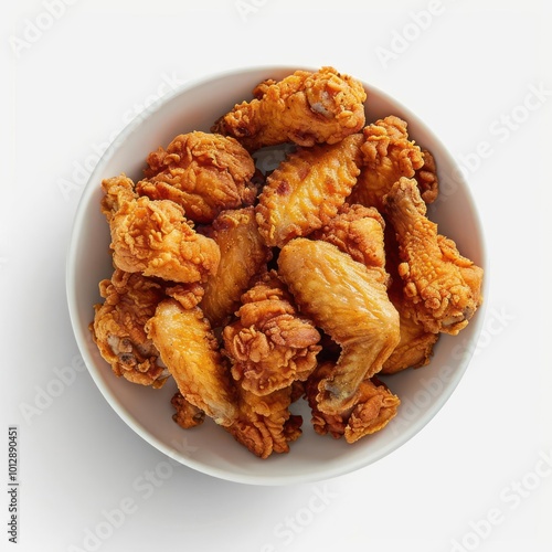 a white bowl filled with fried chicken wings