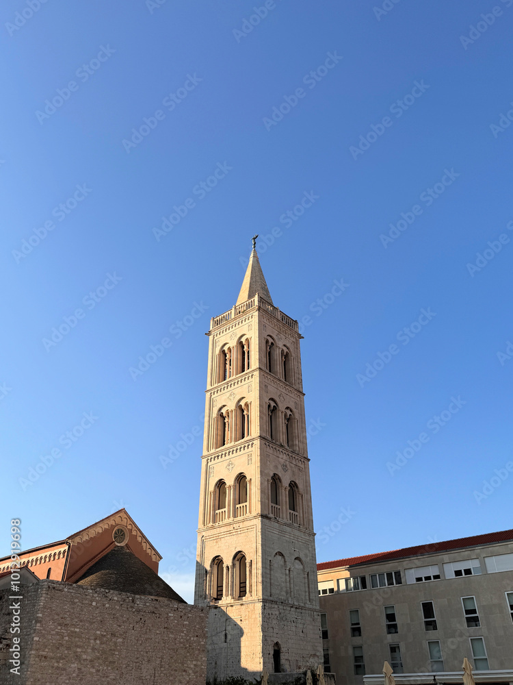 Bell tower of the Cathedral of Saint Anastasia in Zadar. Croatia against clear blue sky with space for text Bell tower of the Cathedral of Saint Anastasia in Zadar. Croatia against clear blue sky with space for text
