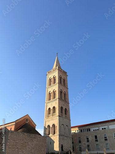 Bell tower of the Cathedral of Saint Anastasia in Zadar. Croatia against clear blue sky with space for text