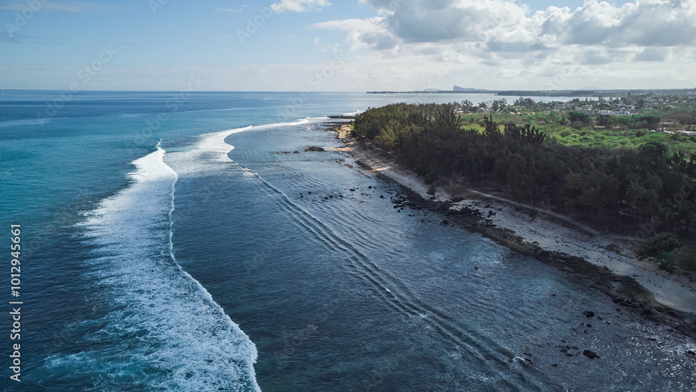 Obraz premium Aerial view in Mauritius over Pointe aux Piments beach, a beautiful tropical beach in the Indian Ocean