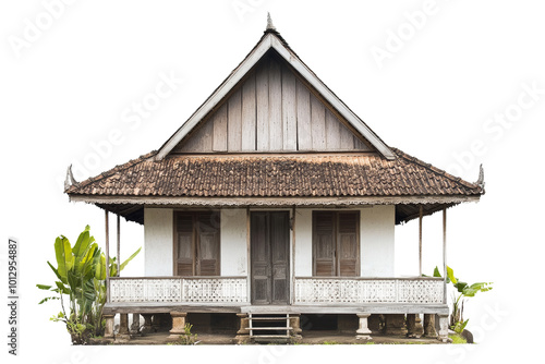 Traditional wooden house with a distinct roof and surrounding greenery, set against a white background. photo