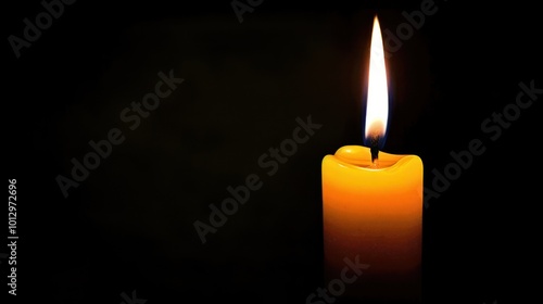 Single Burning Candle on Dark Background