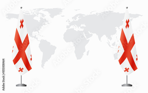 Georgia and Georgia flags for official meeting against background of world map.